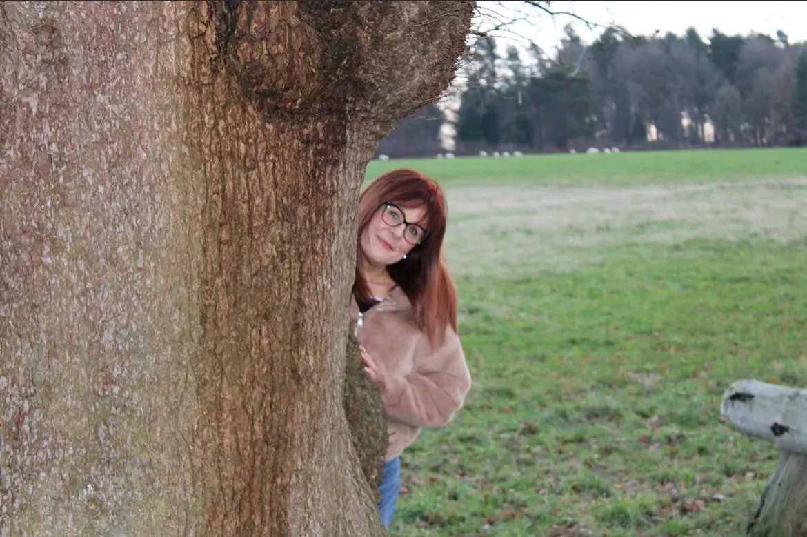 claire dougherty behind tree